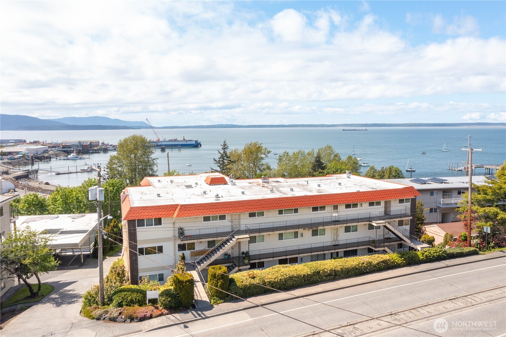 1014 11th Street, Unit 302 Bellingham, WA 98225 - Photo 4 of 30 a view of a balcony with an outdoor seating