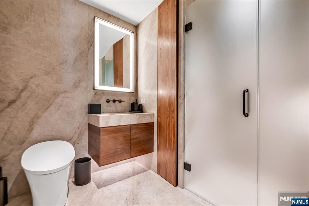 8701 Churchill Road, Unit PH1501 North Bergen, NJ 07047 - Photo 22 of 50 a bathroom with a sink toilet and shower