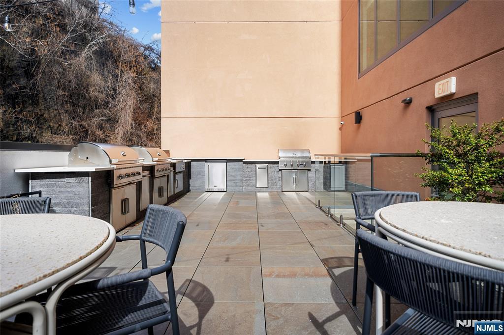 8701 Churchill Road, Unit PH1501 North Bergen, NJ 07047 - Photo 46 of 50 a balcony with a table and chairs