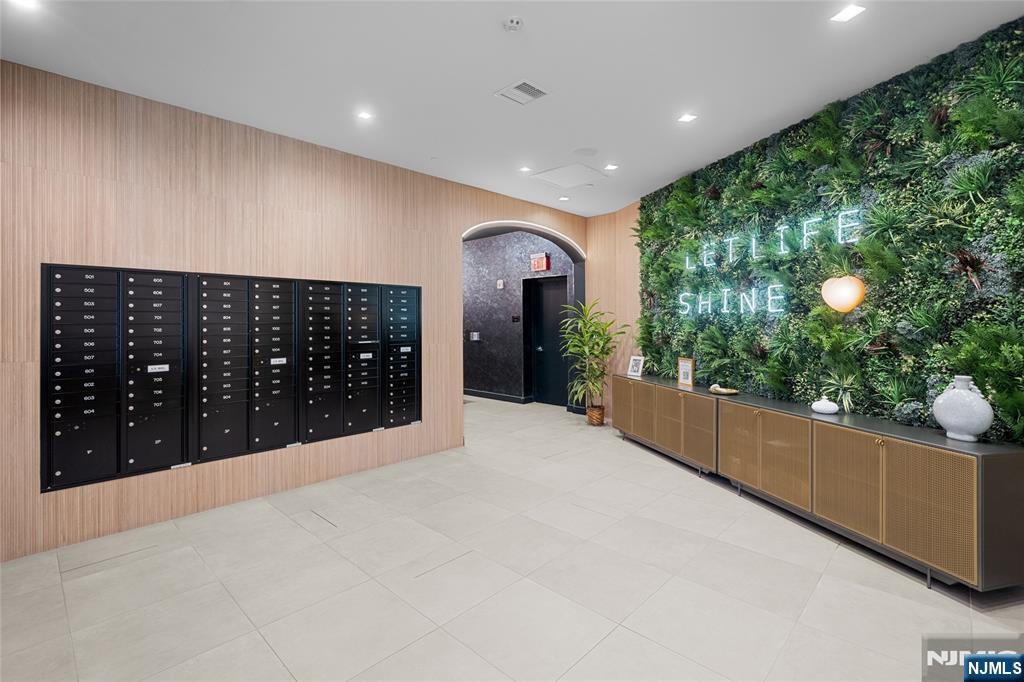 8701 Churchill Road, Unit PH1501 North Bergen, NJ 07047 - Photo 47 of 50 a large room with potted plants and a yard