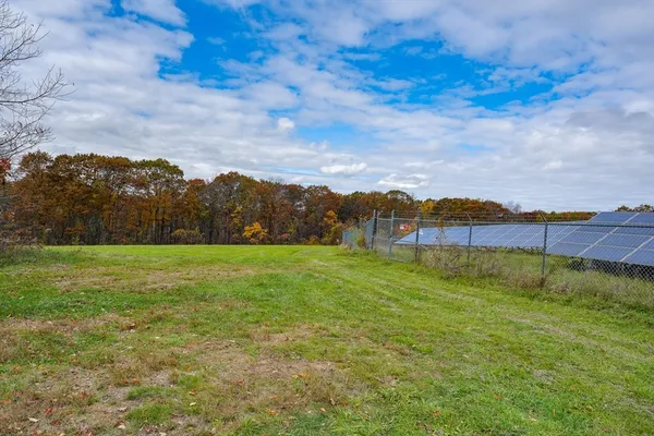 a backyard of a house with lots of green space