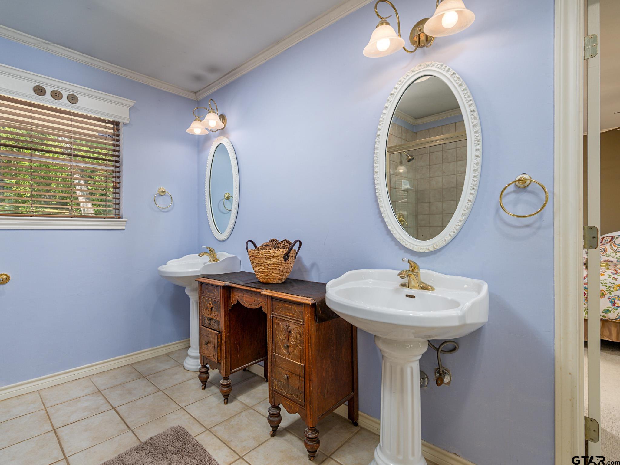 3203 Dinah Lane Tyler, TX 75701 - Photo 18 of 33 a bathroom with a sink a mirror and a toilet