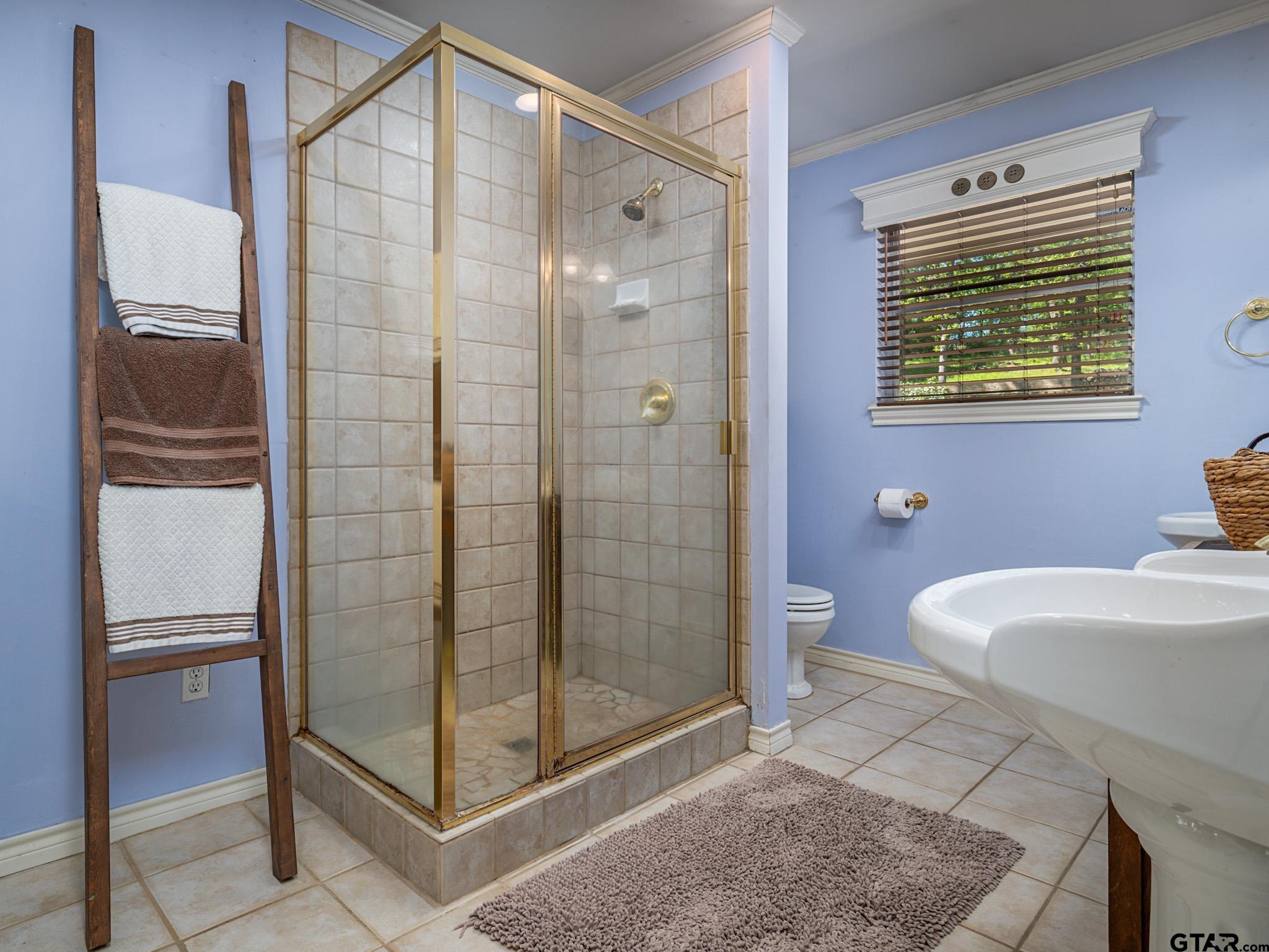 3203 Dinah Lane Tyler, TX 75701 - Photo 19 of 33 a bathroom with a shower and a toilet
