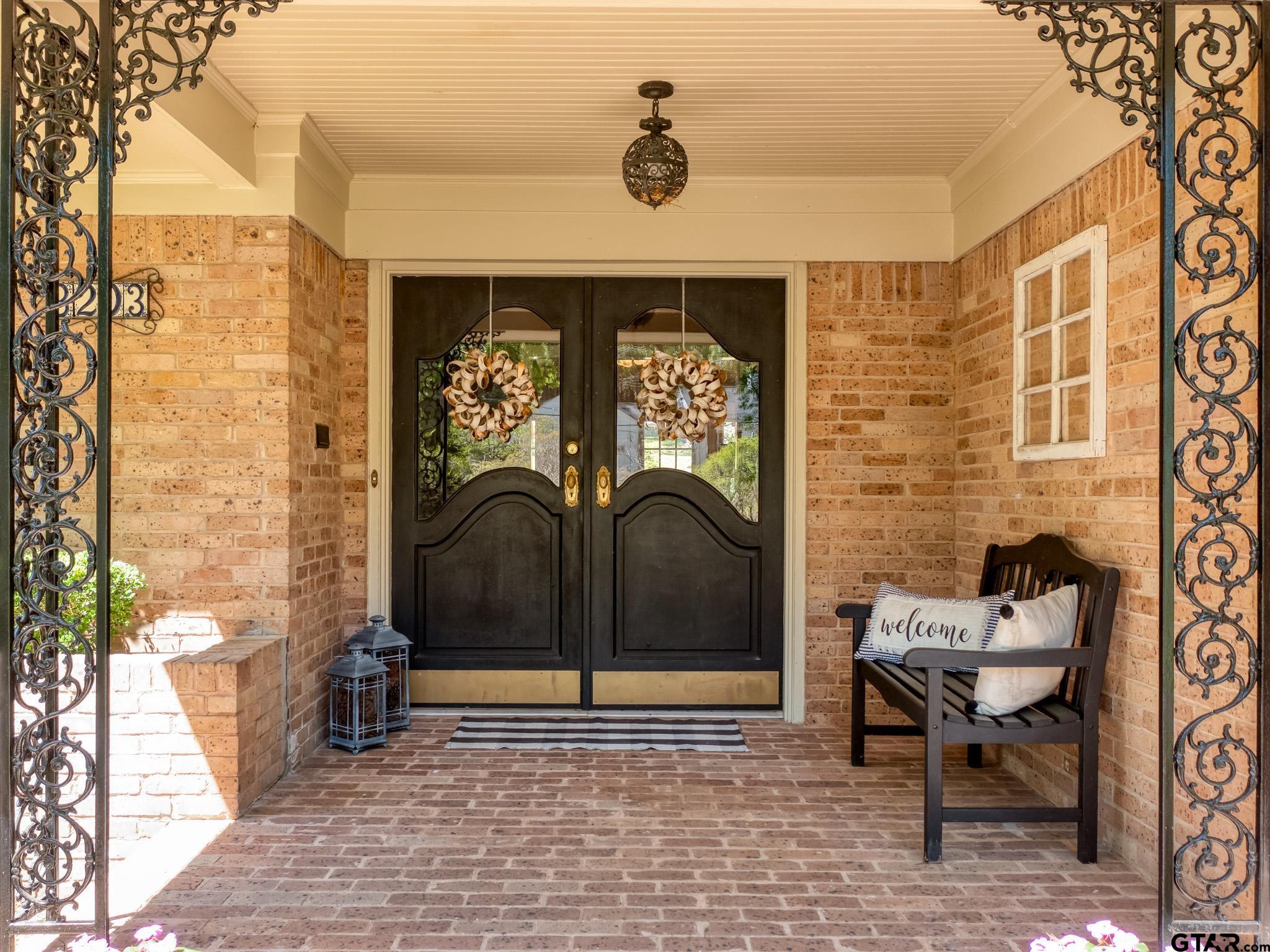 3203 Dinah Lane Tyler, TX 75701 - Photo 2 of 33 a bench sitting in front of a building