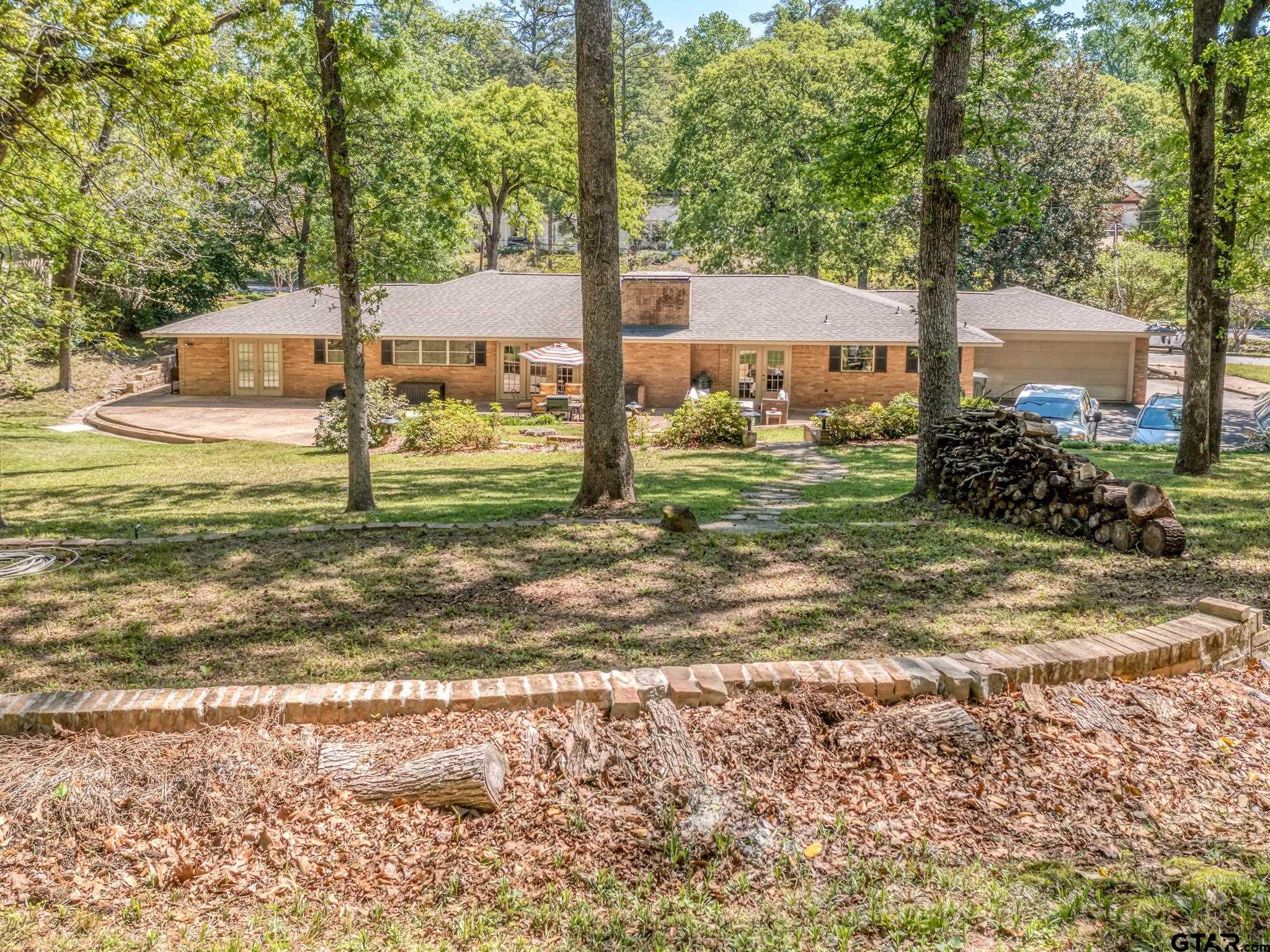 3203 Dinah Lane Tyler, TX 75701 - Photo 28 of 33 a view of a yard with a tree
