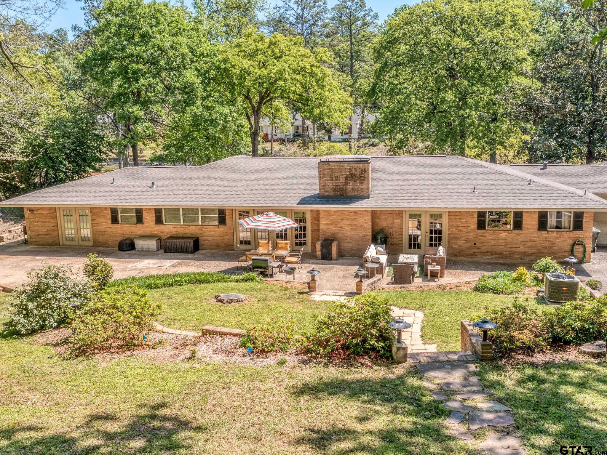 3203 Dinah Lane Tyler, TX 75701 - Photo 29 of 33 a view of a house with swimming pool and sitting area