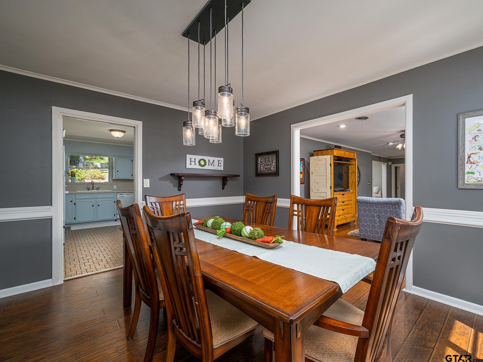 3203 Dinah Lane Tyler, TX 75701 - Photo 7 of 33 a view of a dining room with furniture and wooden floor