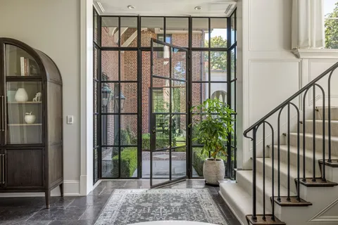 a view of entryway with wooden floor and a potted plant