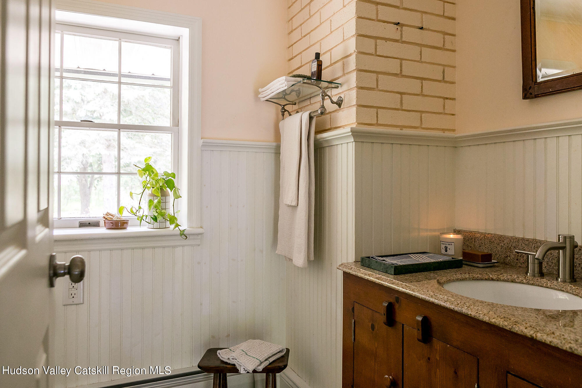 1234 Flatbush Road Kingston, NY 12401 - Photo 23 of 28 a bathroom with a granite countertop sink a toilet and a window