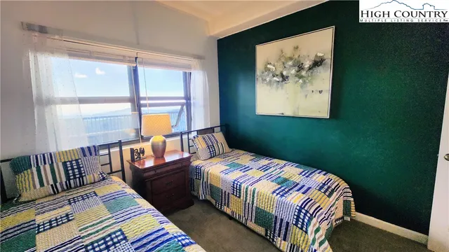 a bedroom with bed and a window