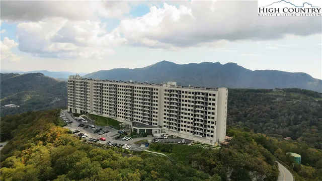 a view of a large building with a mountain