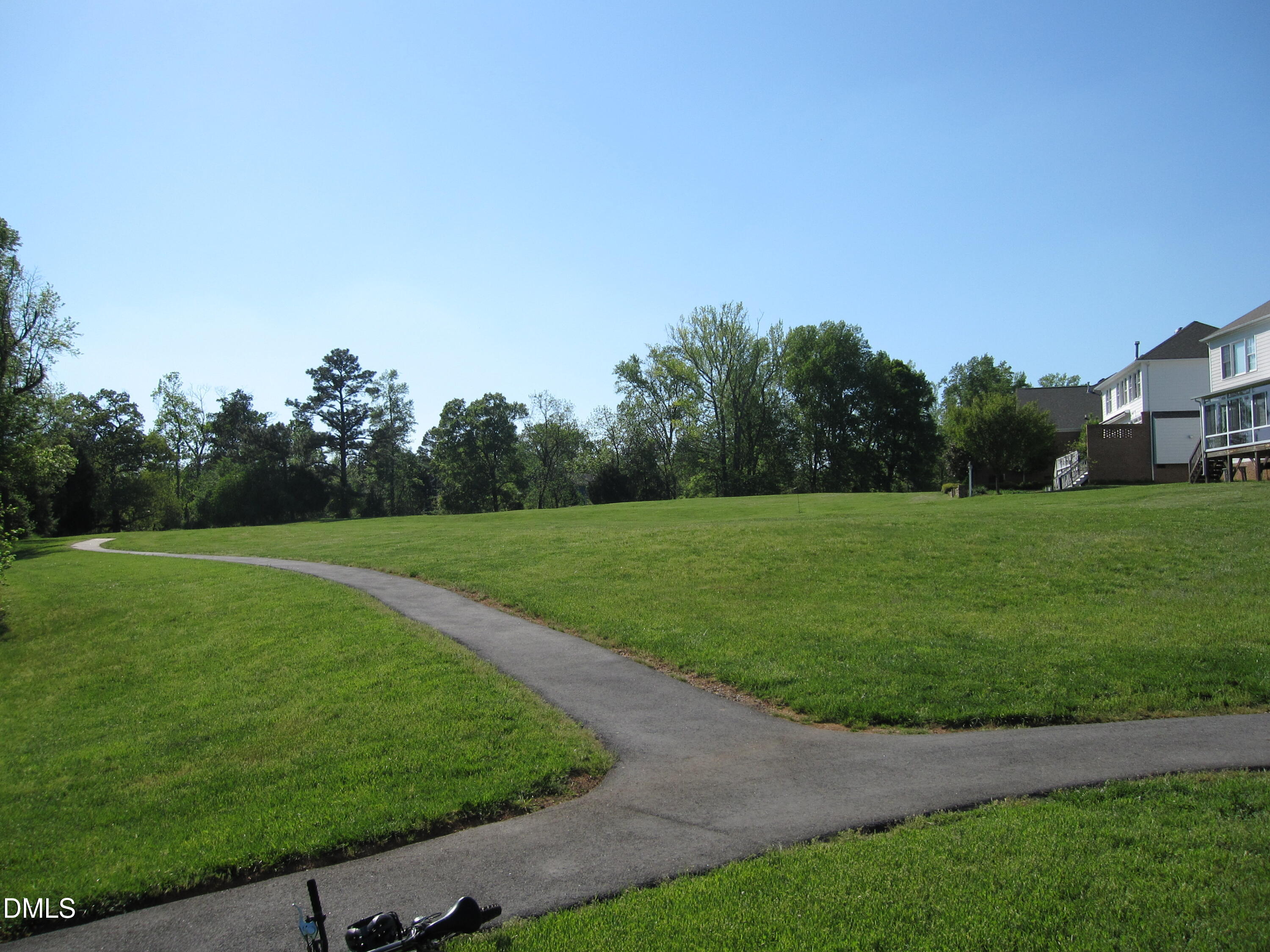 300 Lake Manor Road Chapel Hill, NC 27516 - Photo 97 of 99 a view of a golf course with a garden
