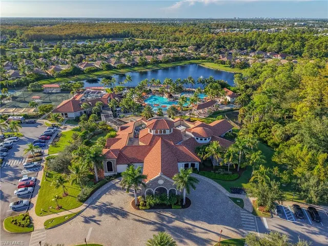 an aerial view of residential building and lake