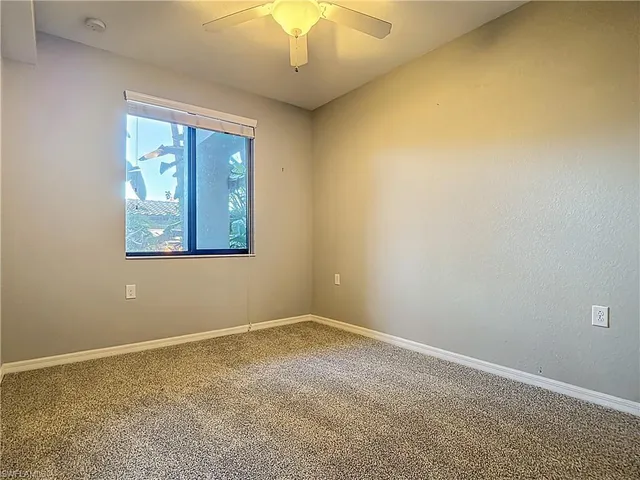 a view of a car parked in a parking lot