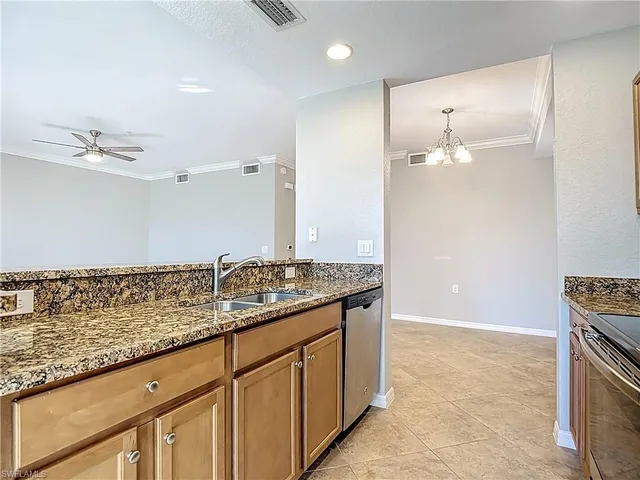 a bathroom with granite countertop a sink and a mirror
