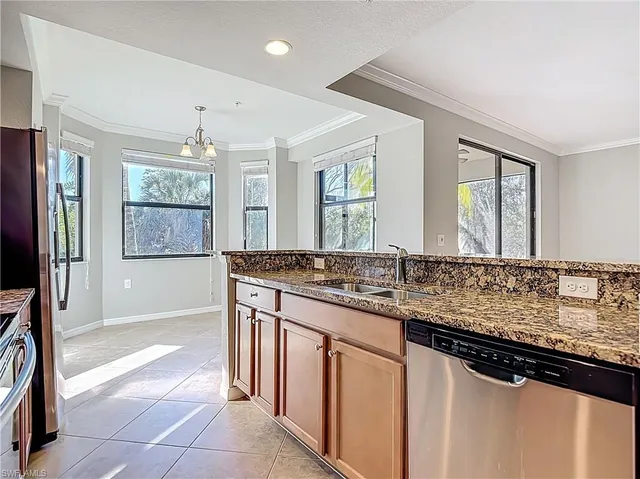 a bathroom with a granite countertop sink a mirror and a bathtub