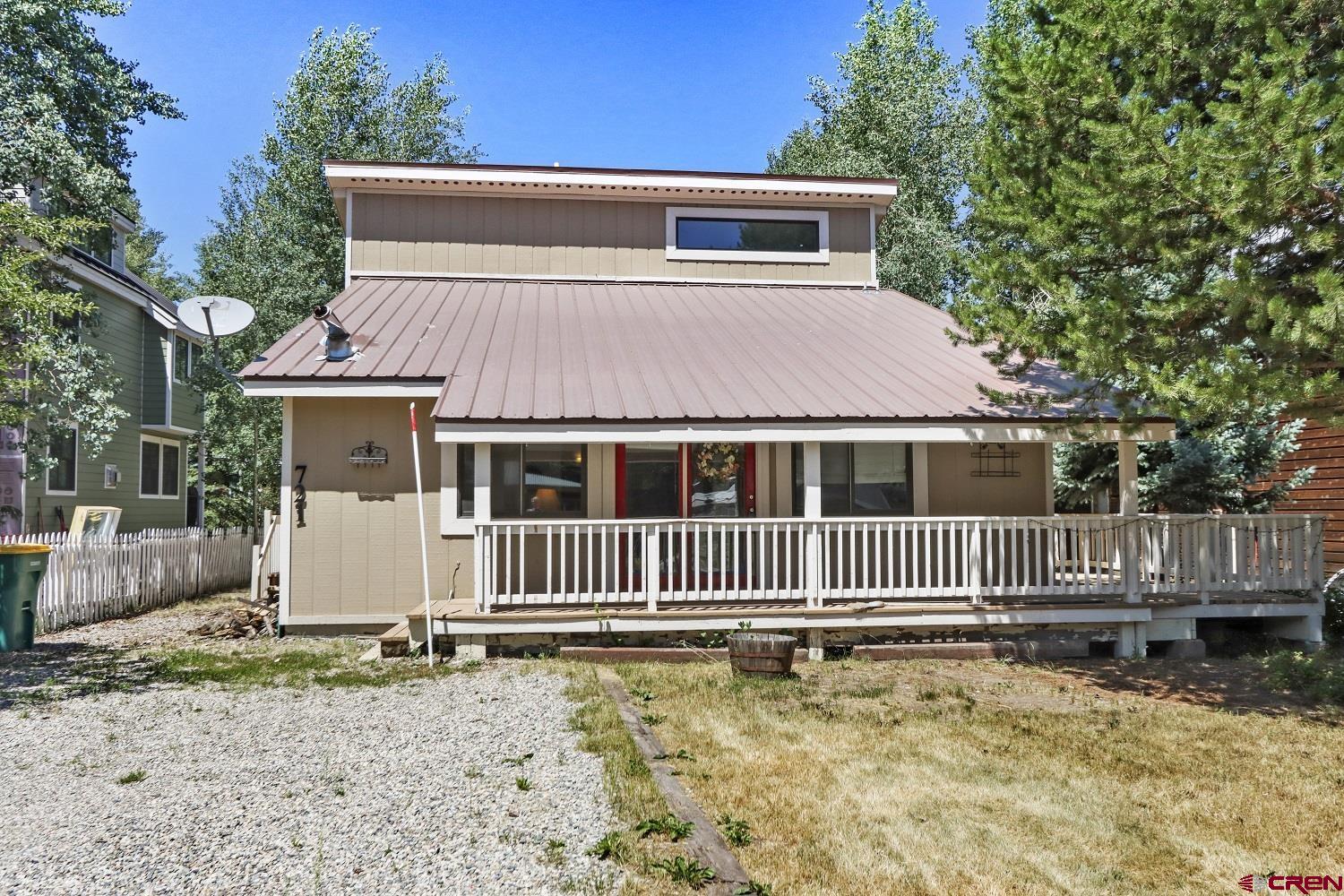 721 Whiterock Avenue Crested Butte, CO 81224 - Photo 2 of 21 a front view of a house with a yard