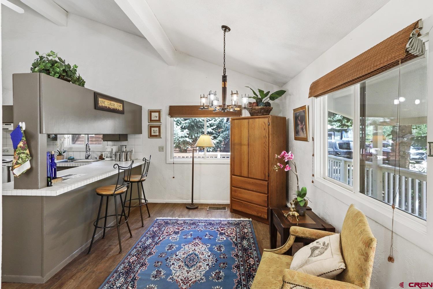 721 Whiterock Avenue Crested Butte, CO 81224 - Photo 8 of 21 a living room with furniture and a chandelier
