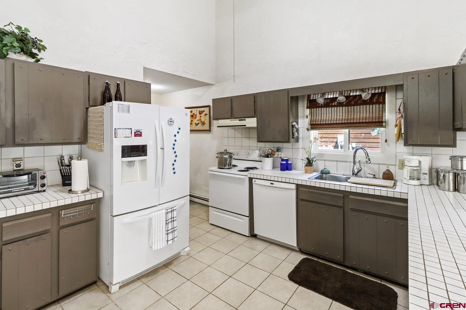 721 Whiterock Avenue Crested Butte, CO 81224 - Photo 9 of 21 a kitchen with appliances cabinets and a sink
