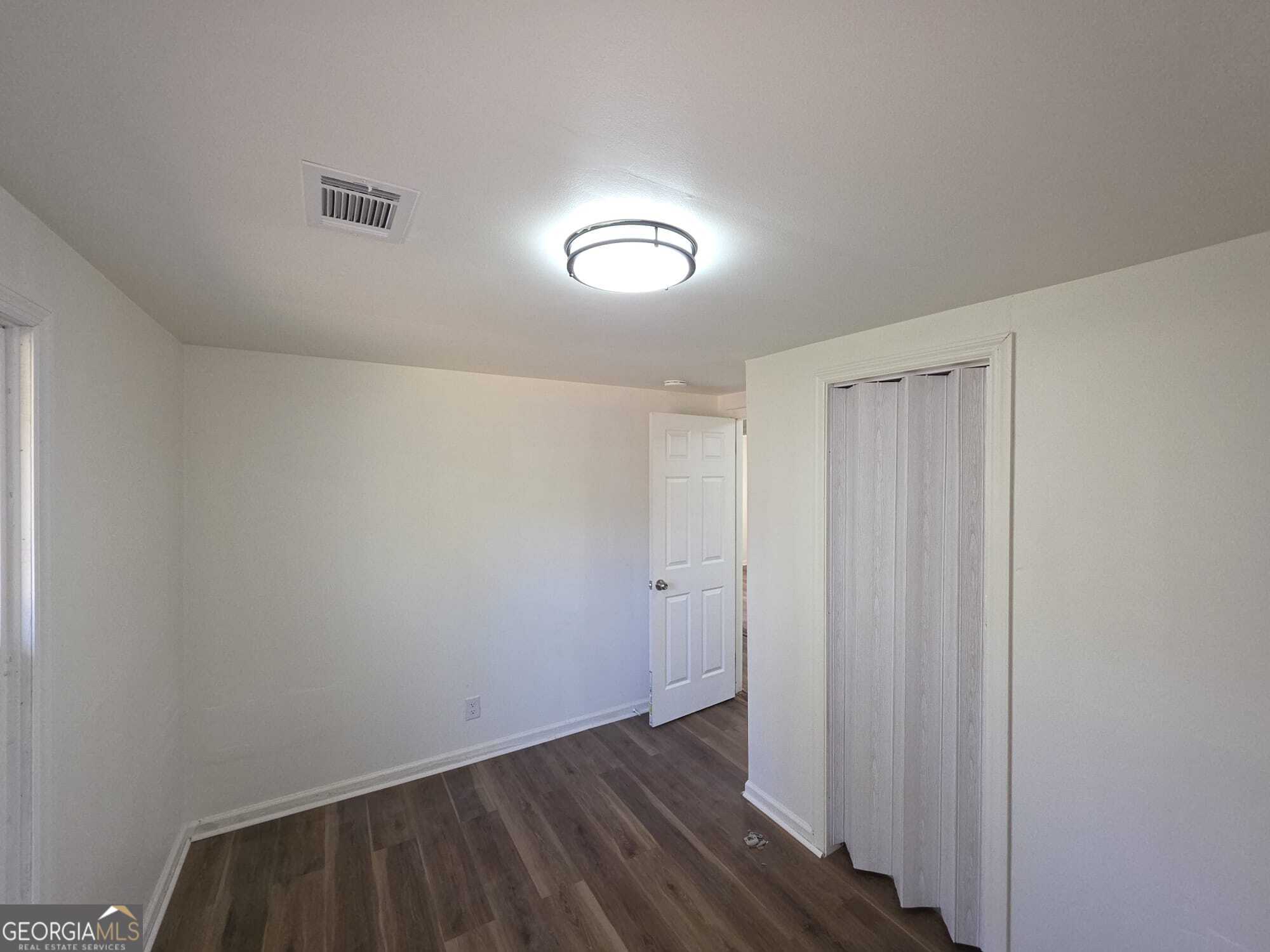 15 Dixie Drive Stockbridge, GA 30281 - Photo 17 of 19 a view of room with wooden floor