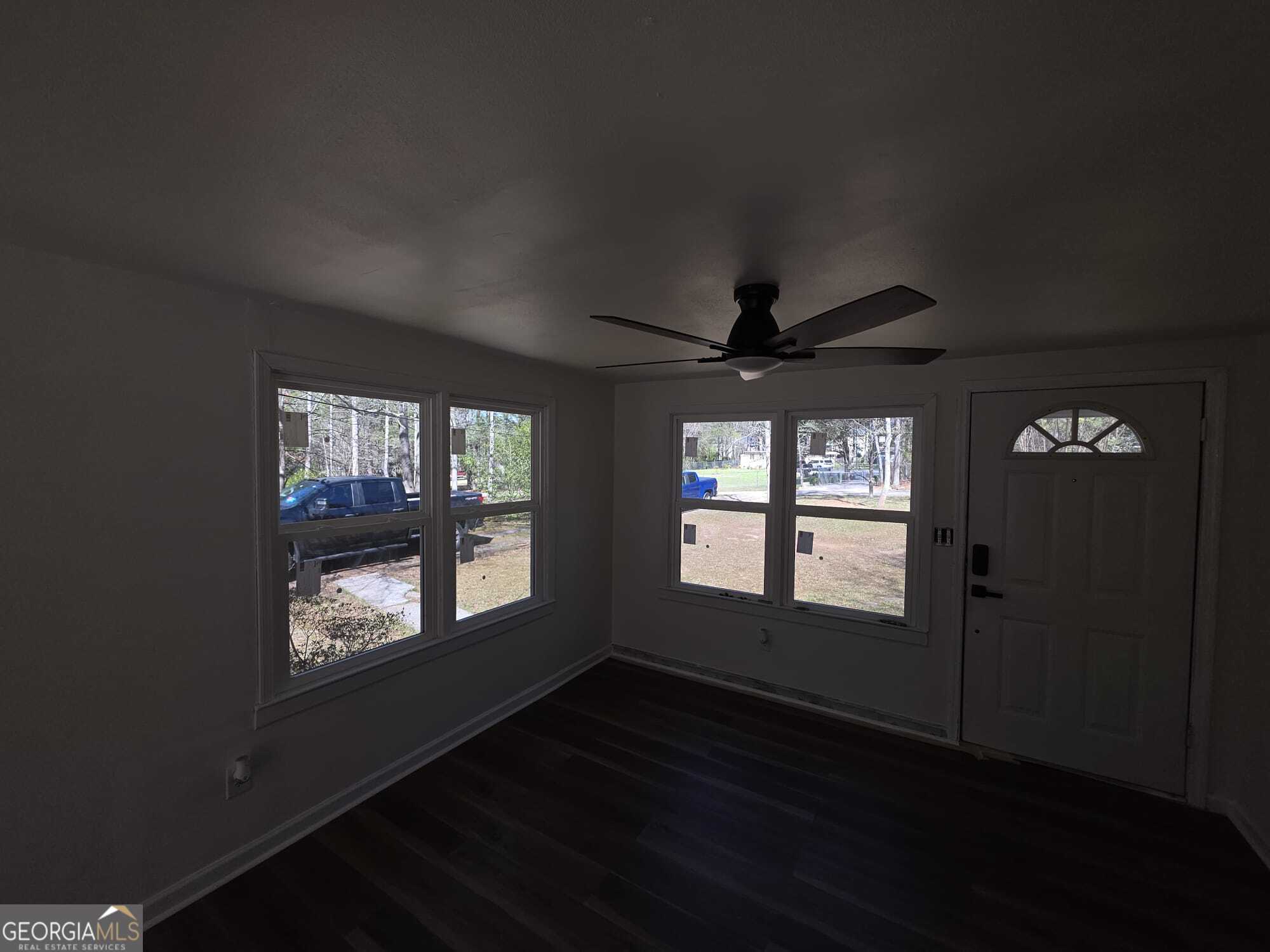 15 Dixie Drive Stockbridge, GA 30281 - Photo 21 of 36 a view of an empty room with wooden floor and a window
