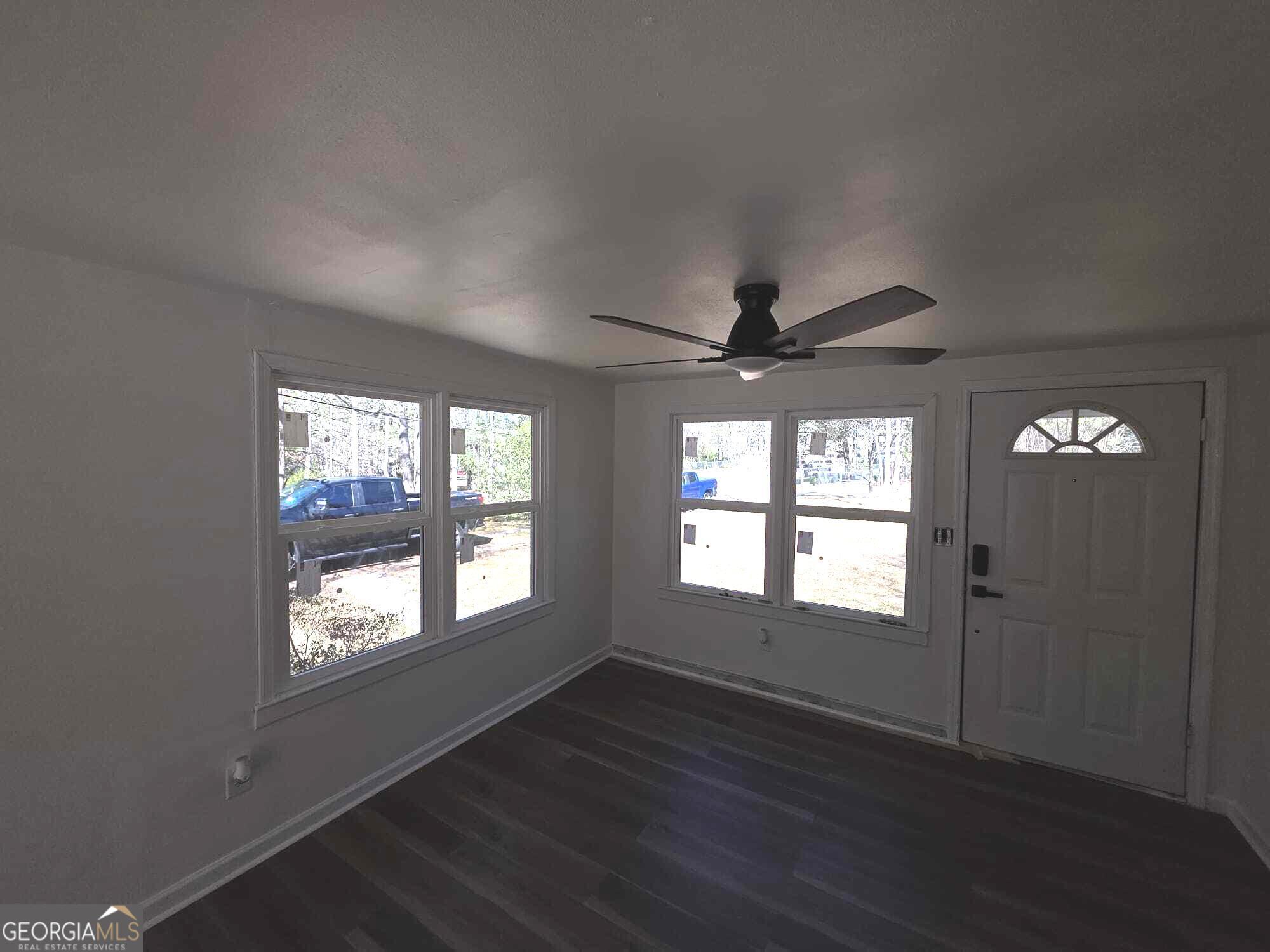 15 Dixie Drive Stockbridge, GA 30281 - Photo 24 of 36 a view of an empty room with wooden floor and a window