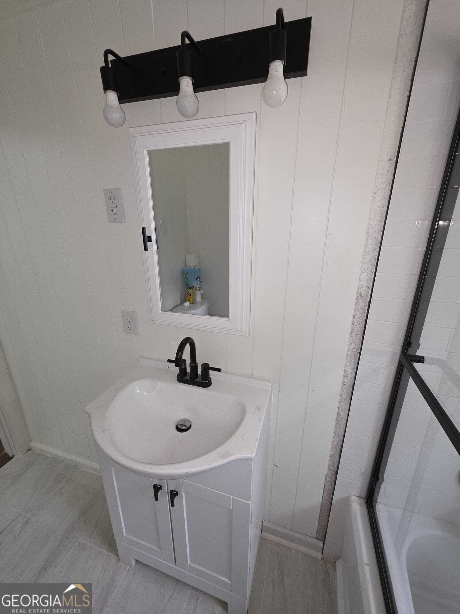 15 Dixie Drive Stockbridge, GA 30281 - Photo 31 of 36 a bathroom with a sink and mirror