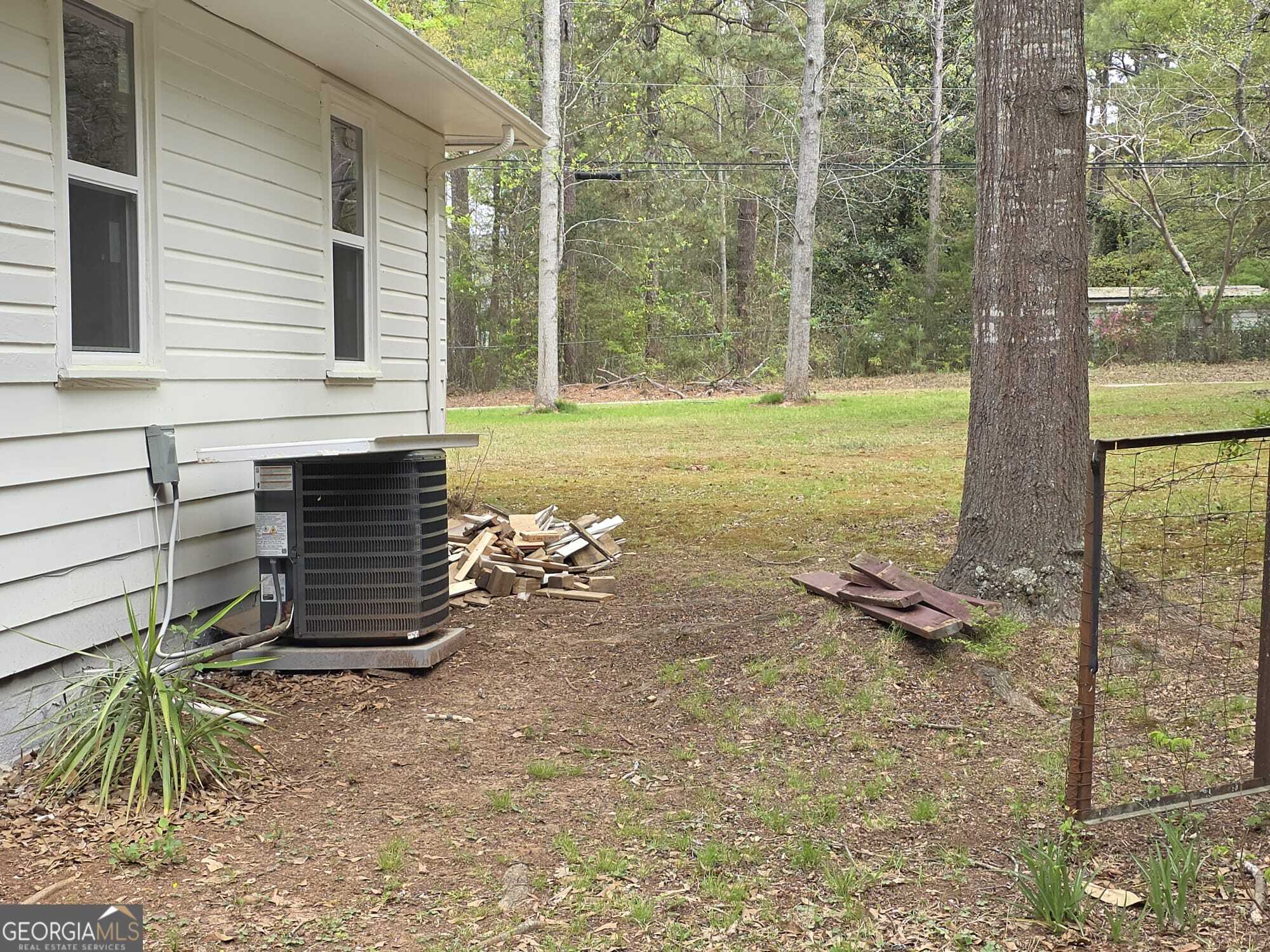 15 Dixie Drive Stockbridge, GA 30281 - Photo 35 of 36 a view of a two chairs in the backyard