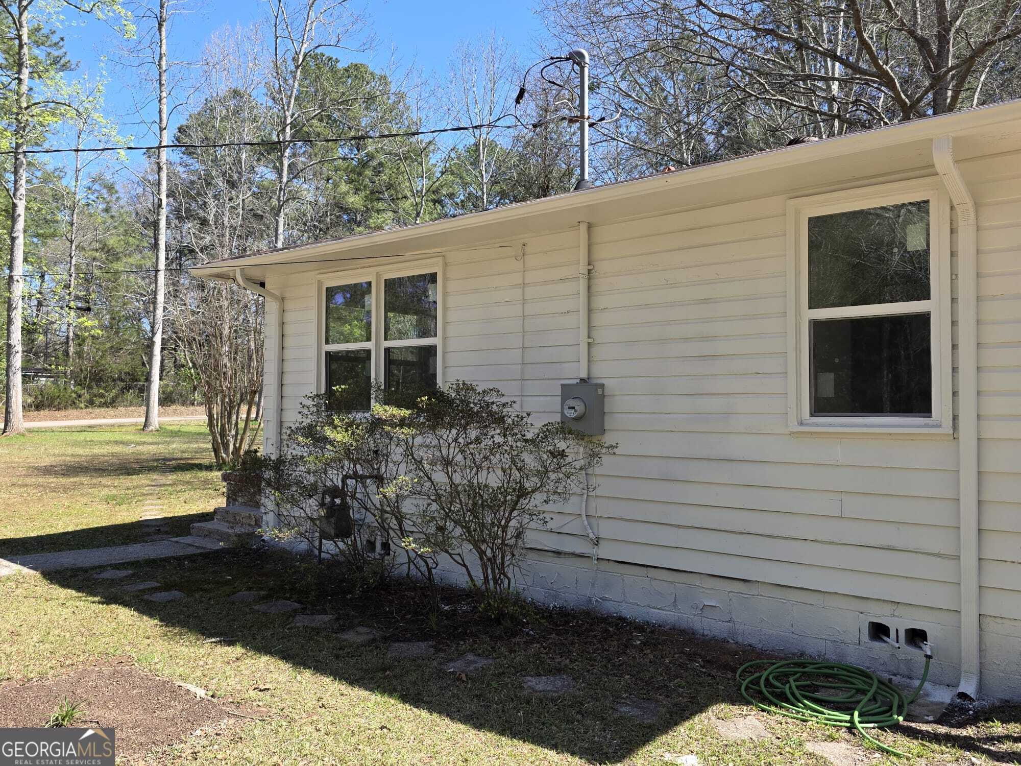 15 Dixie Drive Stockbridge, GA 30281 - Photo 6 of 36 a backyard of a house with outdoor seating