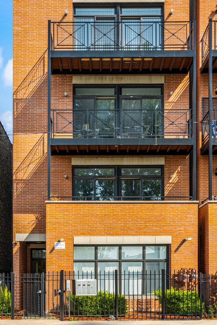 3134 West Walton Street, Unit 4 Chicago, IL 60622 - Photo 1 of 1 a front view of a house with glass windows