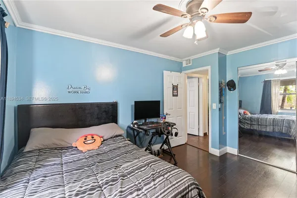 a bedroom with a bed and furniture