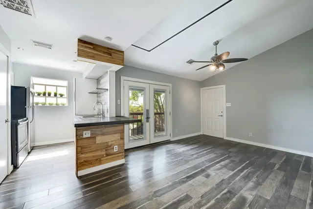 a view of livingroom with hardwood floor and a ceiling fan