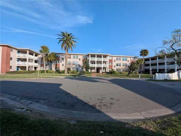 a view of street with a building in the background
