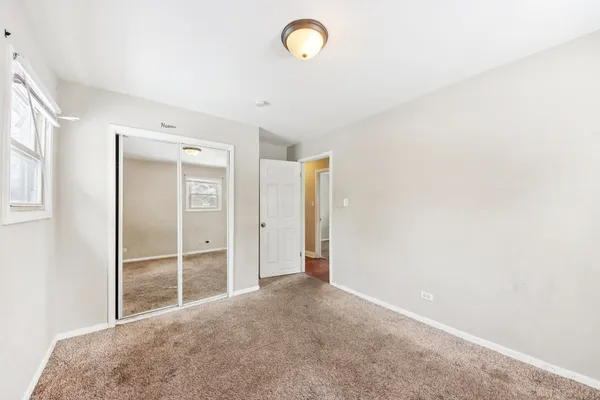 a view of room with window and closet