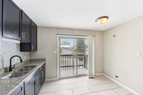 a kitchen with a sink and a window