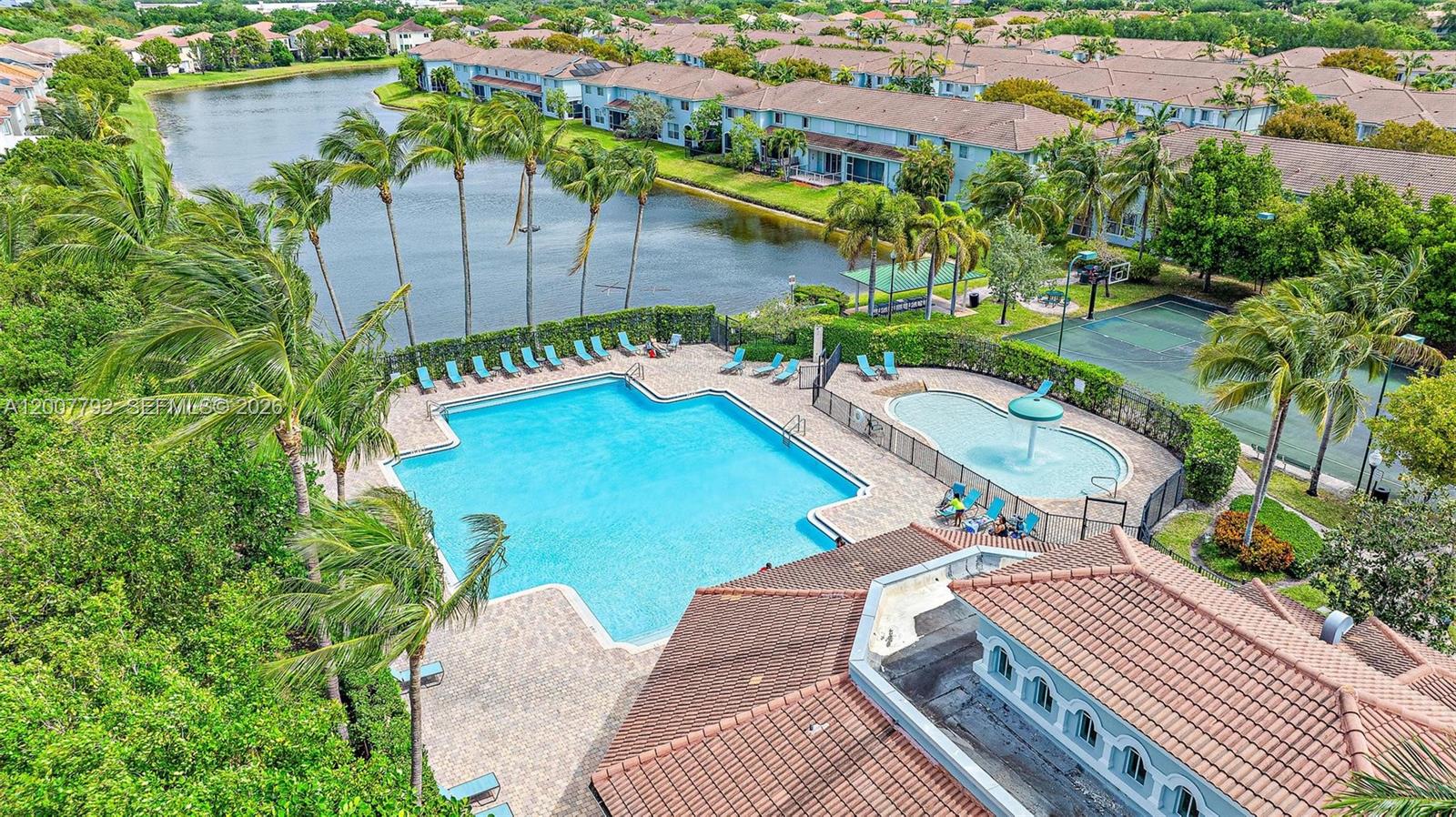 3229 Laurel Ridge Circle, Unit 3229 Riviera Beach, FL 33404 - Photo 16 of 24 an aerial view of a house with a yard pool patio and outdoor seating