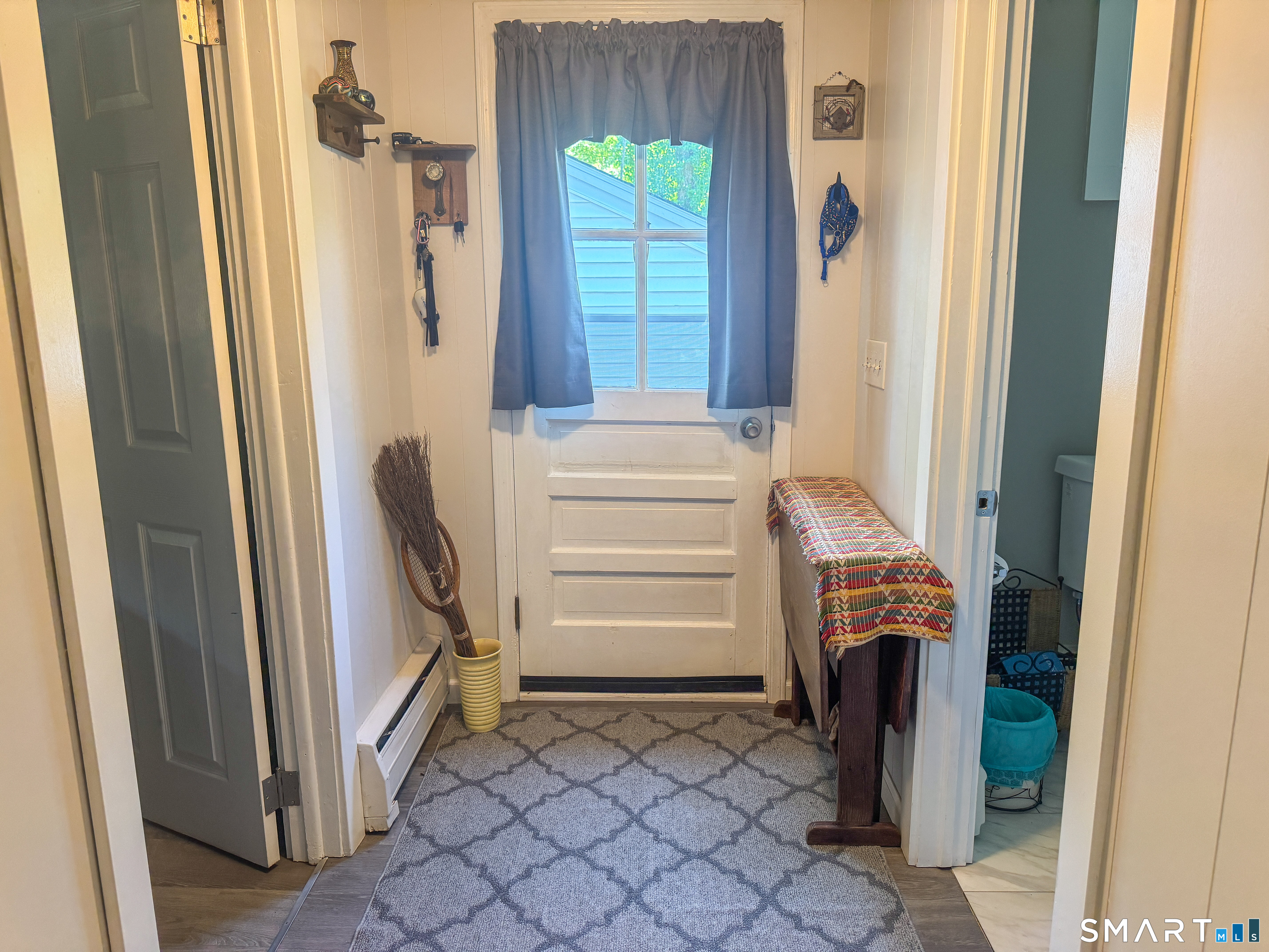 36 Jennings Street Norwich, CT 06360 - Photo 15 of 33 a view of walk in closet with window and a bathroom