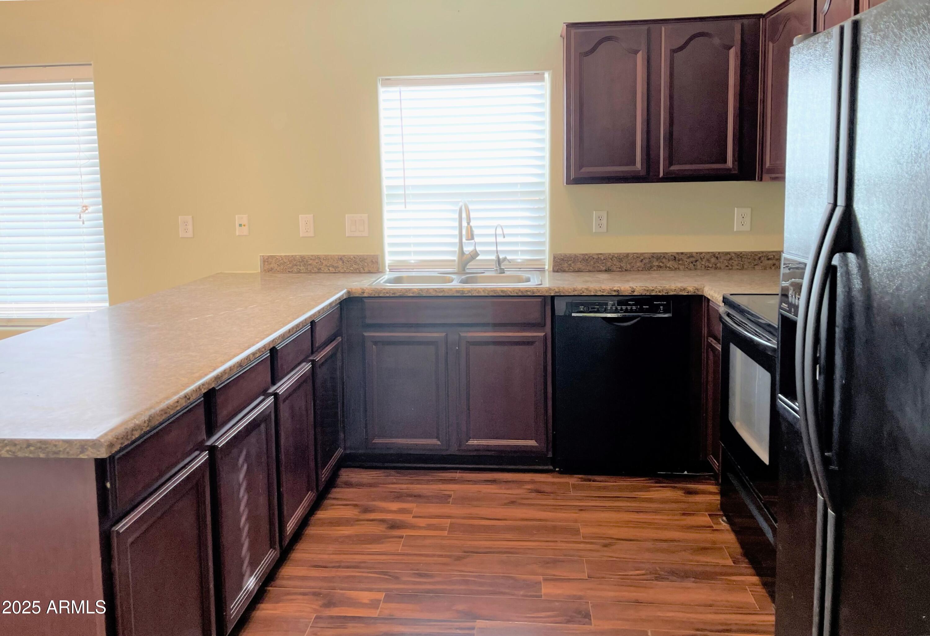 3984 East Tanzanite Lane San Tan Valley, AZ 85143 - Photo 5 of 20 a kitchen with stainless steel appliances granite countertop a refrigerator and a sink