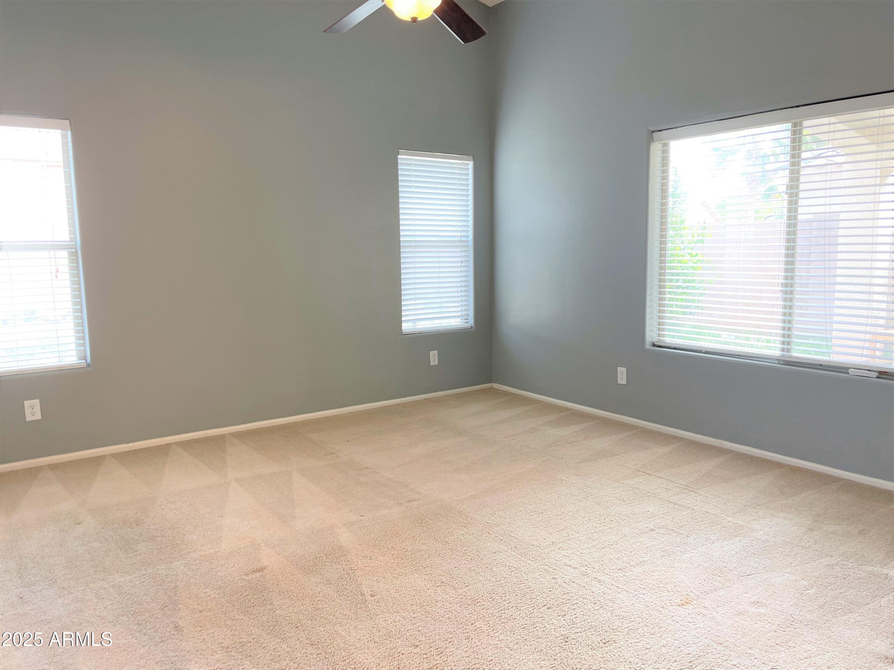 3984 East Tanzanite Lane San Tan Valley, AZ 85143 - Photo 6 of 20 an empty room with a window