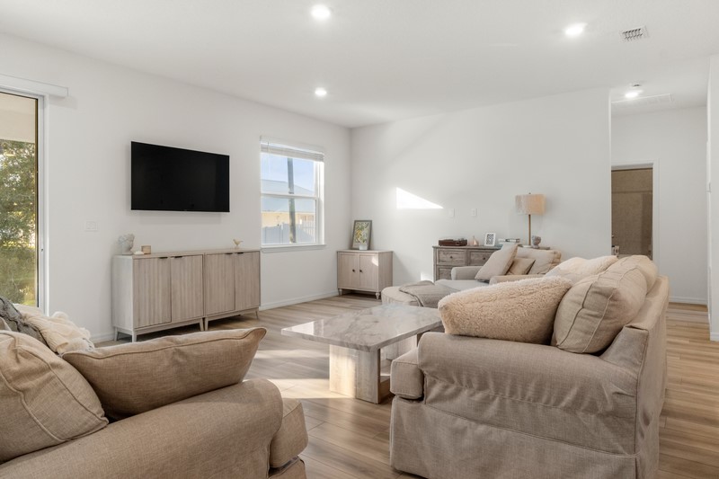 1014 Guava Street Sebastian, FL 32958 - Photo 16 of 30 a living room with furniture and a flat screen tv