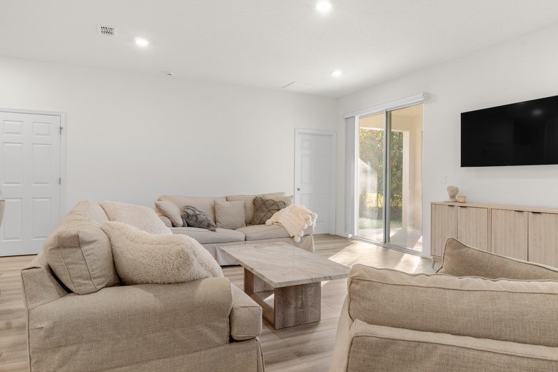 1014 Guava Street Sebastian, FL 32958 - Photo 17 of 30 a living room with furniture and a flat screen tv