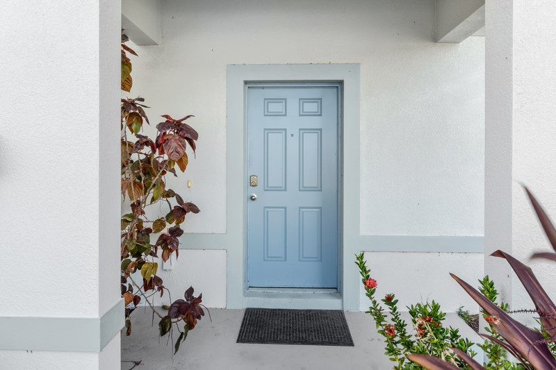 1014 Guava Street Sebastian, FL 32958 - Photo 5 of 30 an entryway with a flower pot and a wooden floor