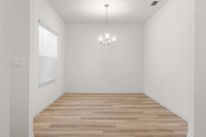 1014 Guava Street Sebastian, FL 32958 - Photo 10 of 30 a view of a room with wooden floor and window