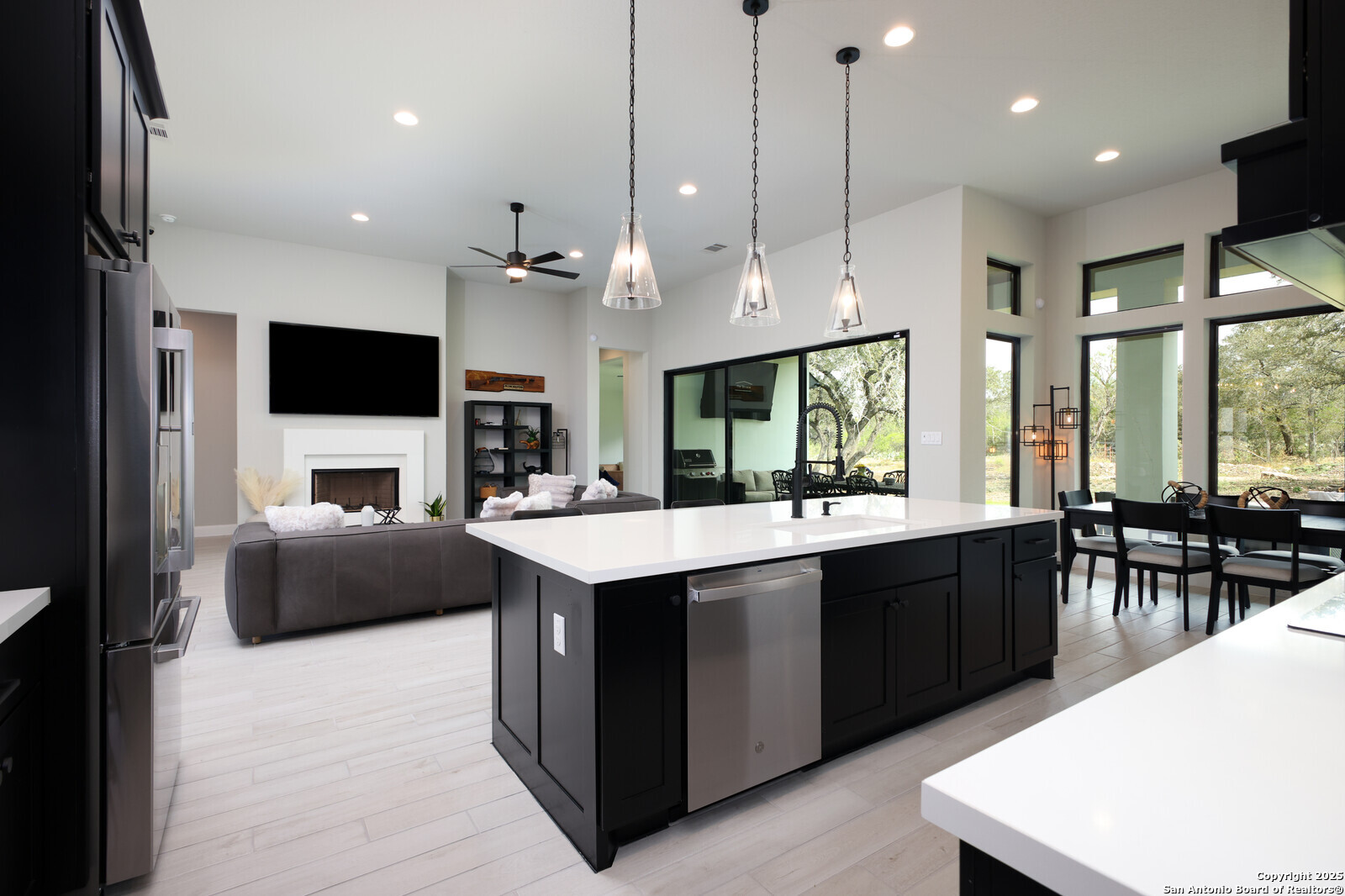 431 Falcon Cove Castroville, TX 78009 - Photo 13 of 46 a large kitchen with kitchen island a sink a counter space and stainless steel appliances