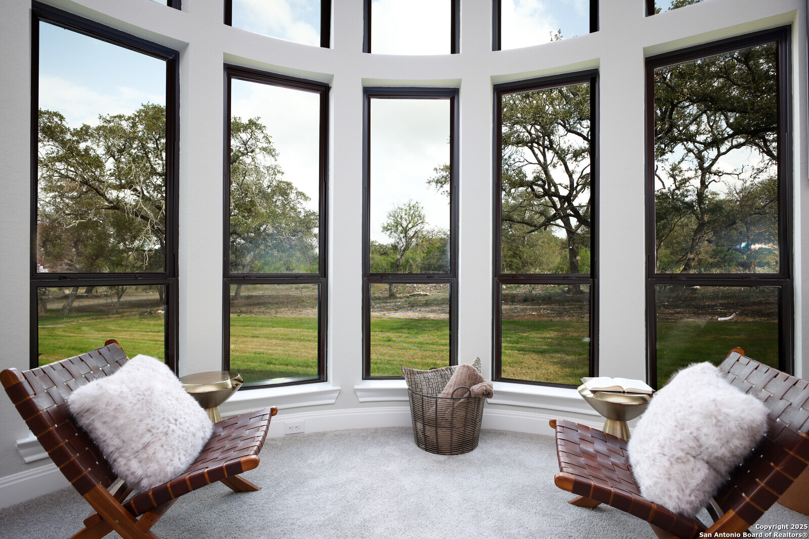 431 Falcon Cove Castroville, TX 78009 - Photo 18 of 46 a living room with furniture and floor to ceiling windows
