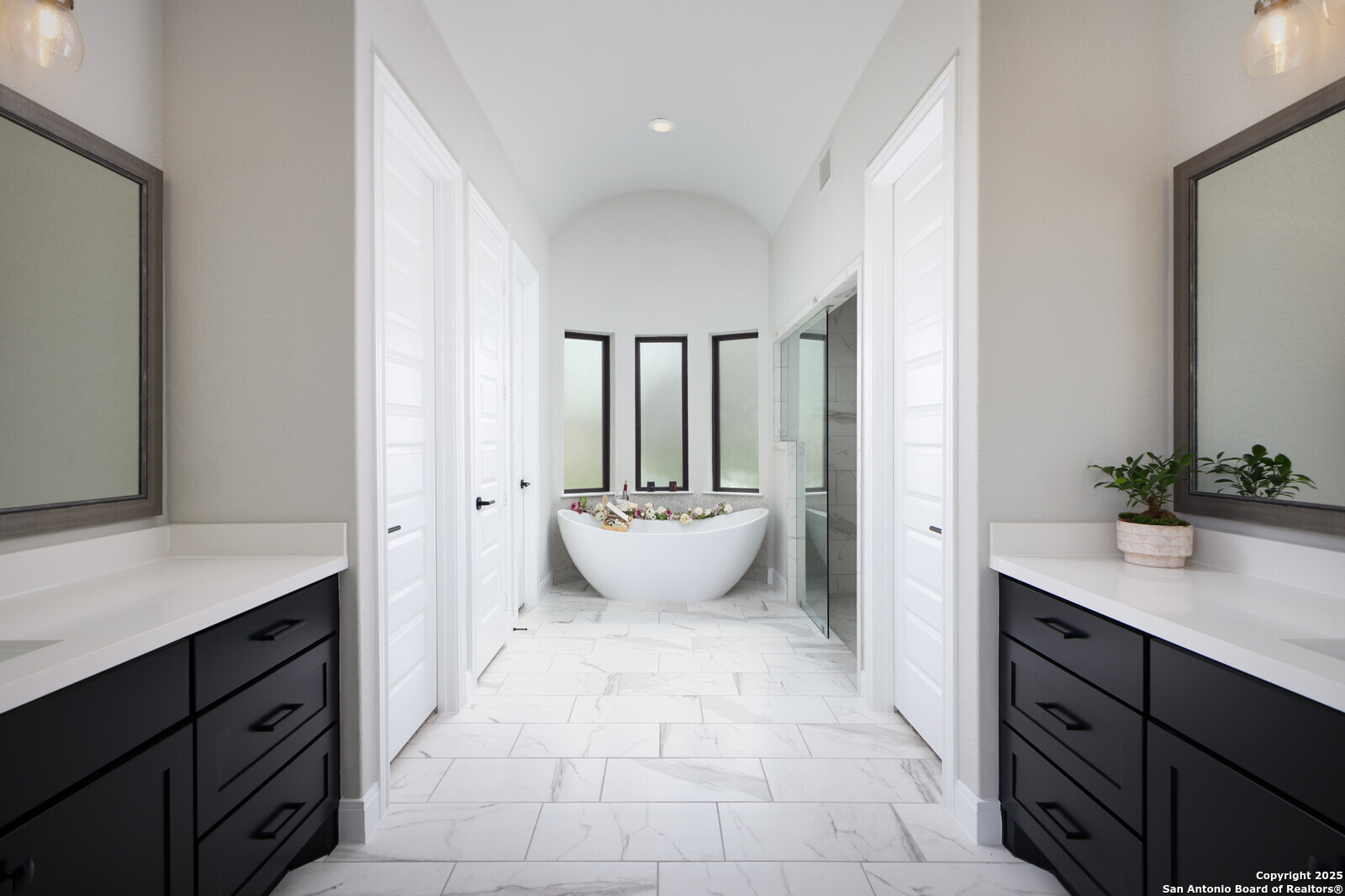 431 Falcon Cove Castroville, TX 78009 - Photo 19 of 46 a view of a bathroom with a sink and mirror