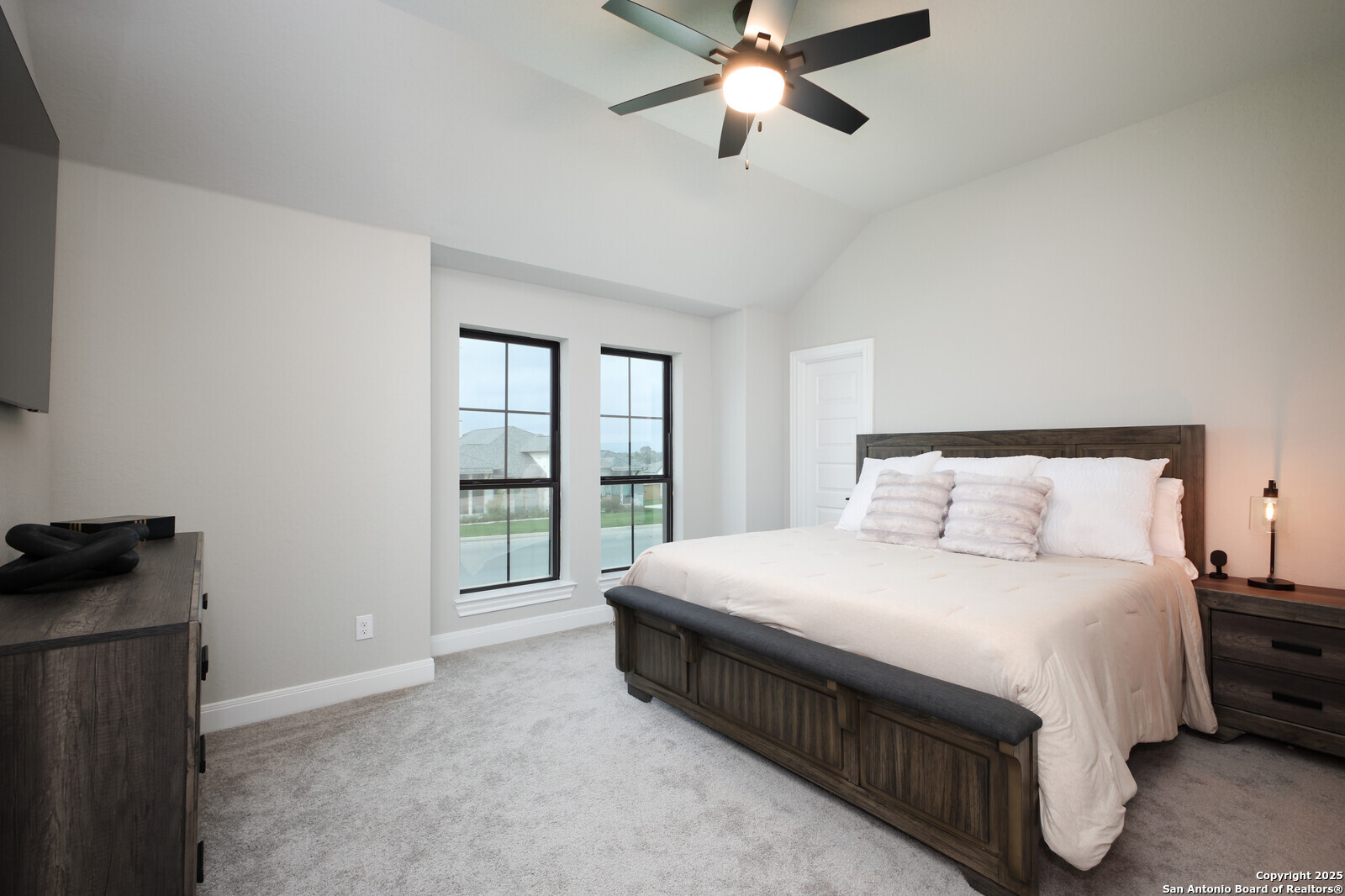 431 Falcon Cove Castroville, TX 78009 - Photo 23 of 46 a bedroom with a bed and a window