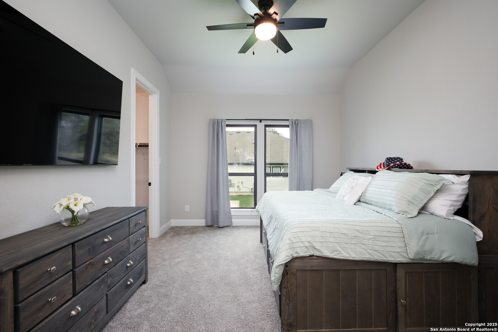 431 Falcon Cove Castroville, TX 78009 - Photo 26 of 46 a bedroom with a bed and window