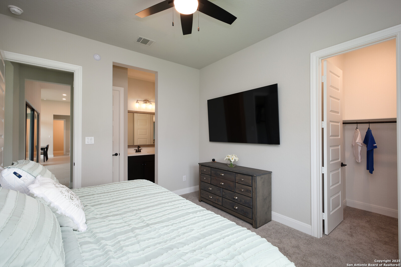 431 Falcon Cove Castroville, TX 78009 - Photo 27 of 46 a bedroom with a bed and a flat screen tv