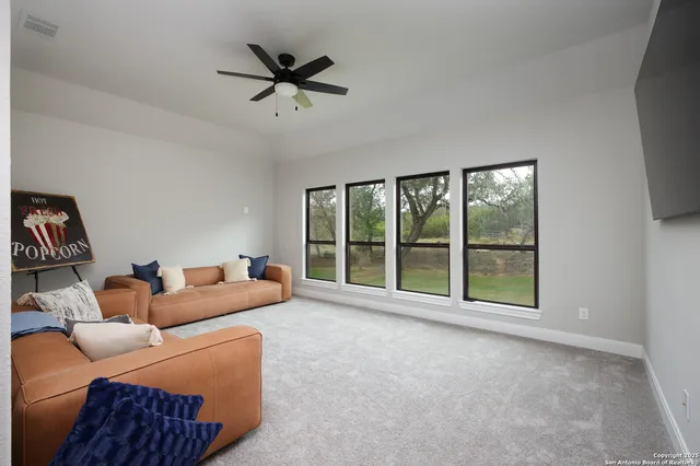 a view of hallway with cabinets and wooden floor